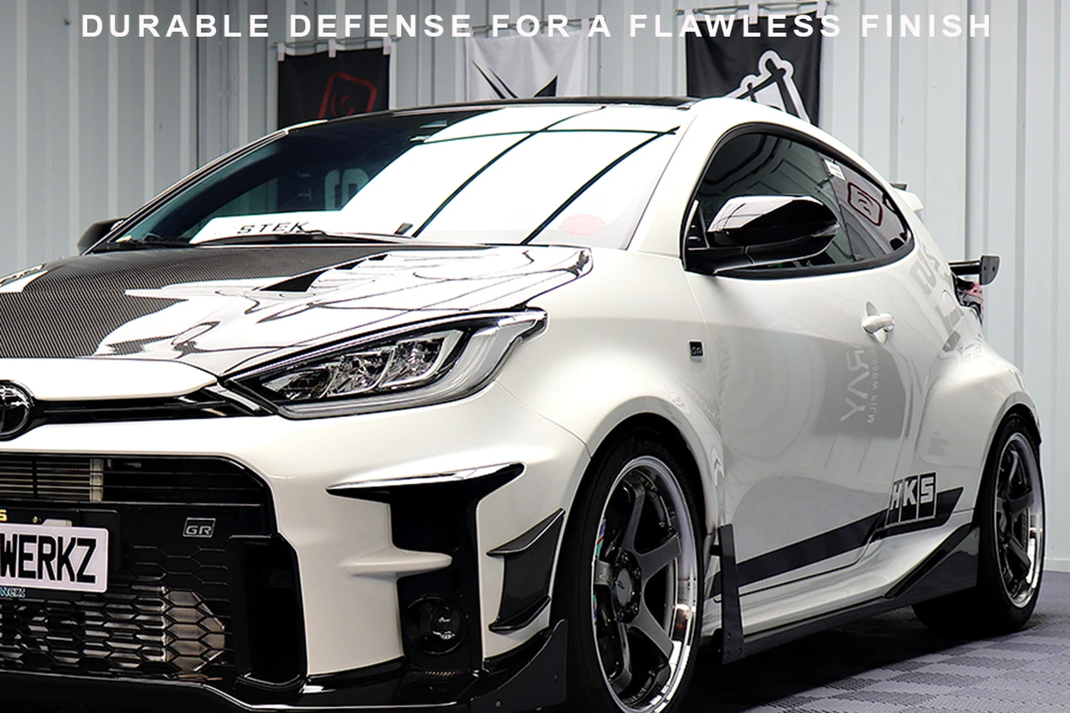 White XstaticWerkz vehicle protected with STEK paint protection film